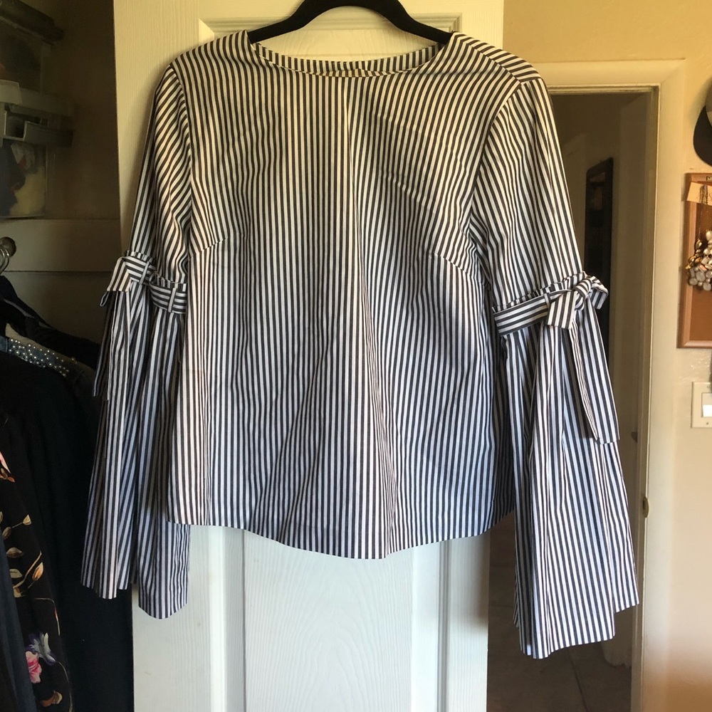 Strip bell sleeve top with button down back